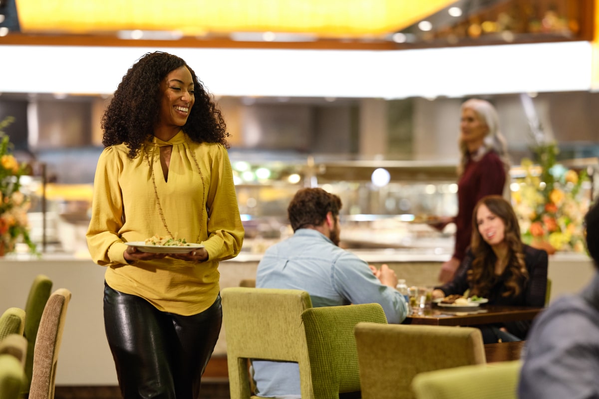 woman with plate of food at buffet